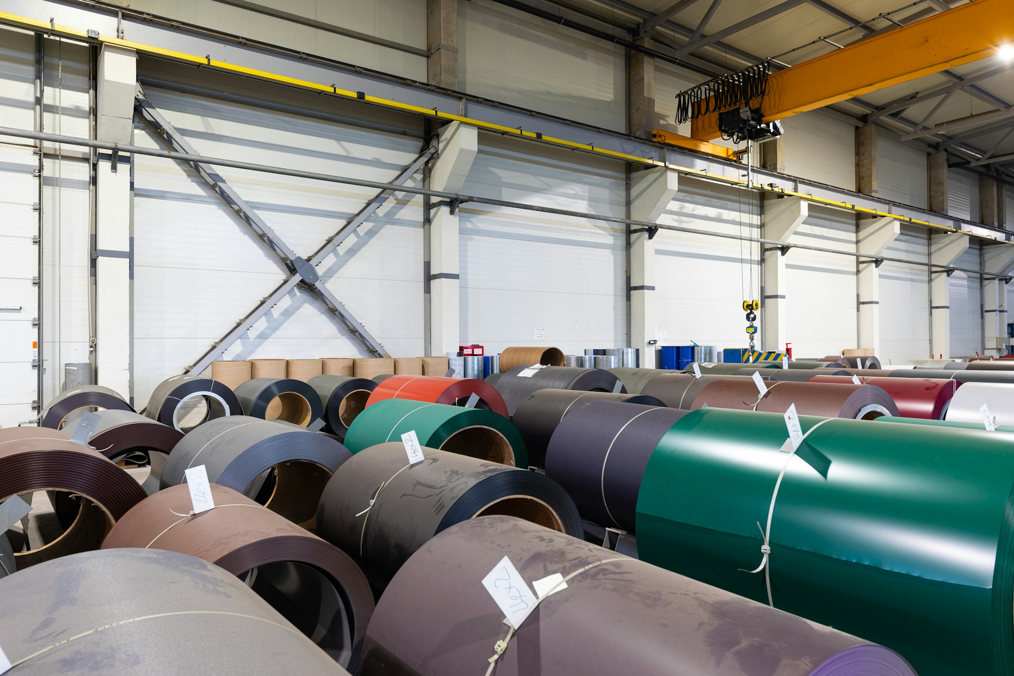 Photo shot of rolls of steel sheet stored in warehouse; Cold rolled steel coils at the factory